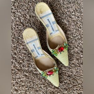 Manolo Blahnik jeweled pointed kitten heels.